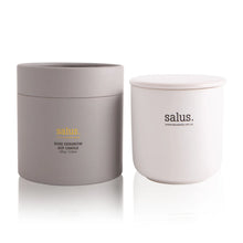 Load image into Gallery viewer, Two cylindrical soy porcelain candles with white and rose gold color schemes, labeled 'salus. rose geranium'.