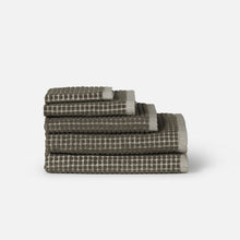 Load image into Gallery viewer, Stack of checkered towels on a white background